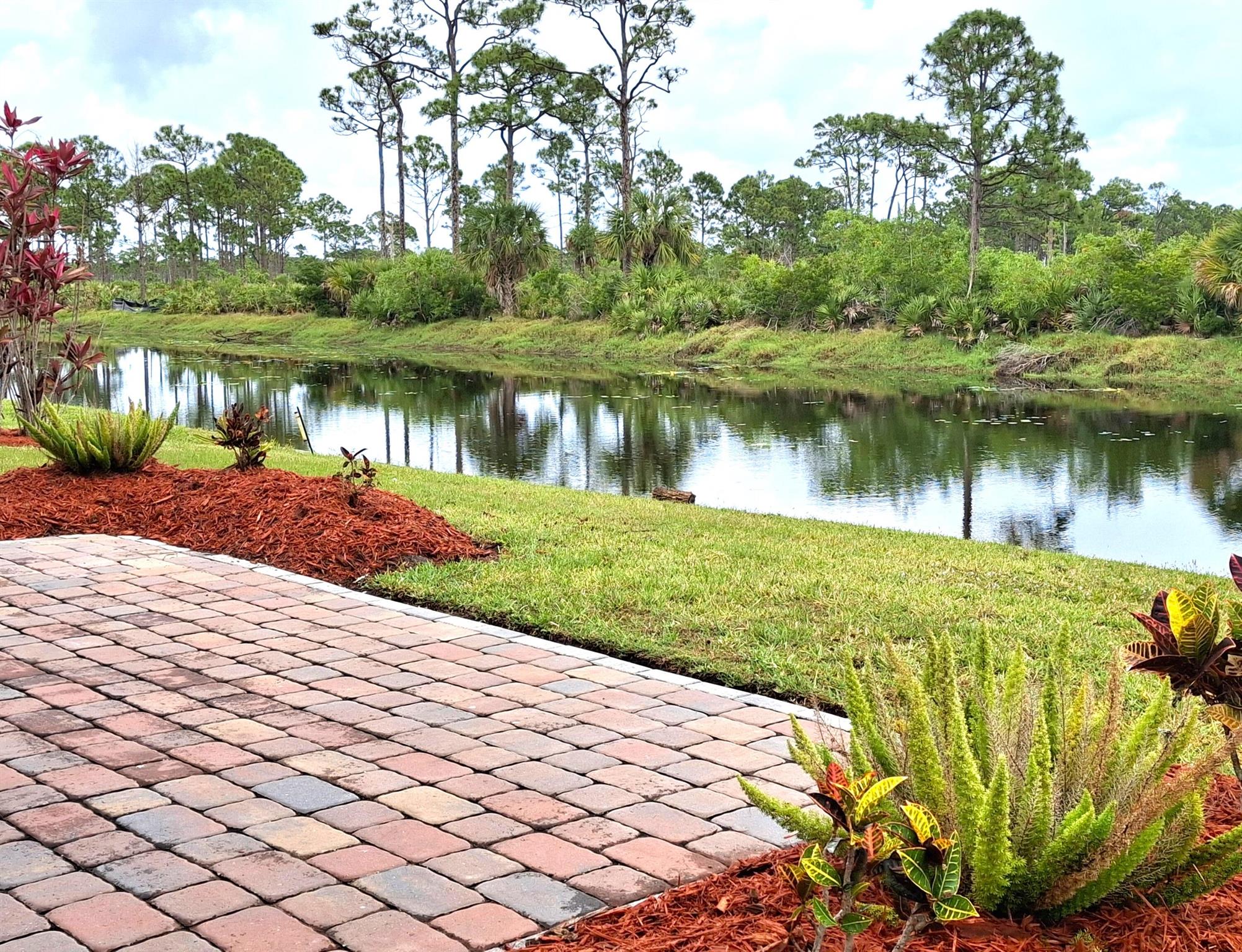 LAND OWNED ON THE PRESERVE CANAL. Desirable location backed up to the Savanna Preserve State Park Canal. WATERFRONT! No one will build behind you. The views of the wildlife from the spacious Florida room and Lanai is spectacular. Fish from your own backyard! Spacious and open 2/2 home with a laundry room comes fully furnished, turnkey. New laminate counters in the kitchen with a custom backsplash. New refrigerator, microwave, dishwasher, disposal, sink & faucet as well. The guest bath has a new vanity, toilet and lighting. The spacious primary bedroom fits a king sized bed and the primary bath has dual sinks, tile flooring and a separate shower. Home has luxury vinyl plank flooring and tile. This location is one of the most desirable lots in Savanna Club. Make this home YOUR HOME!