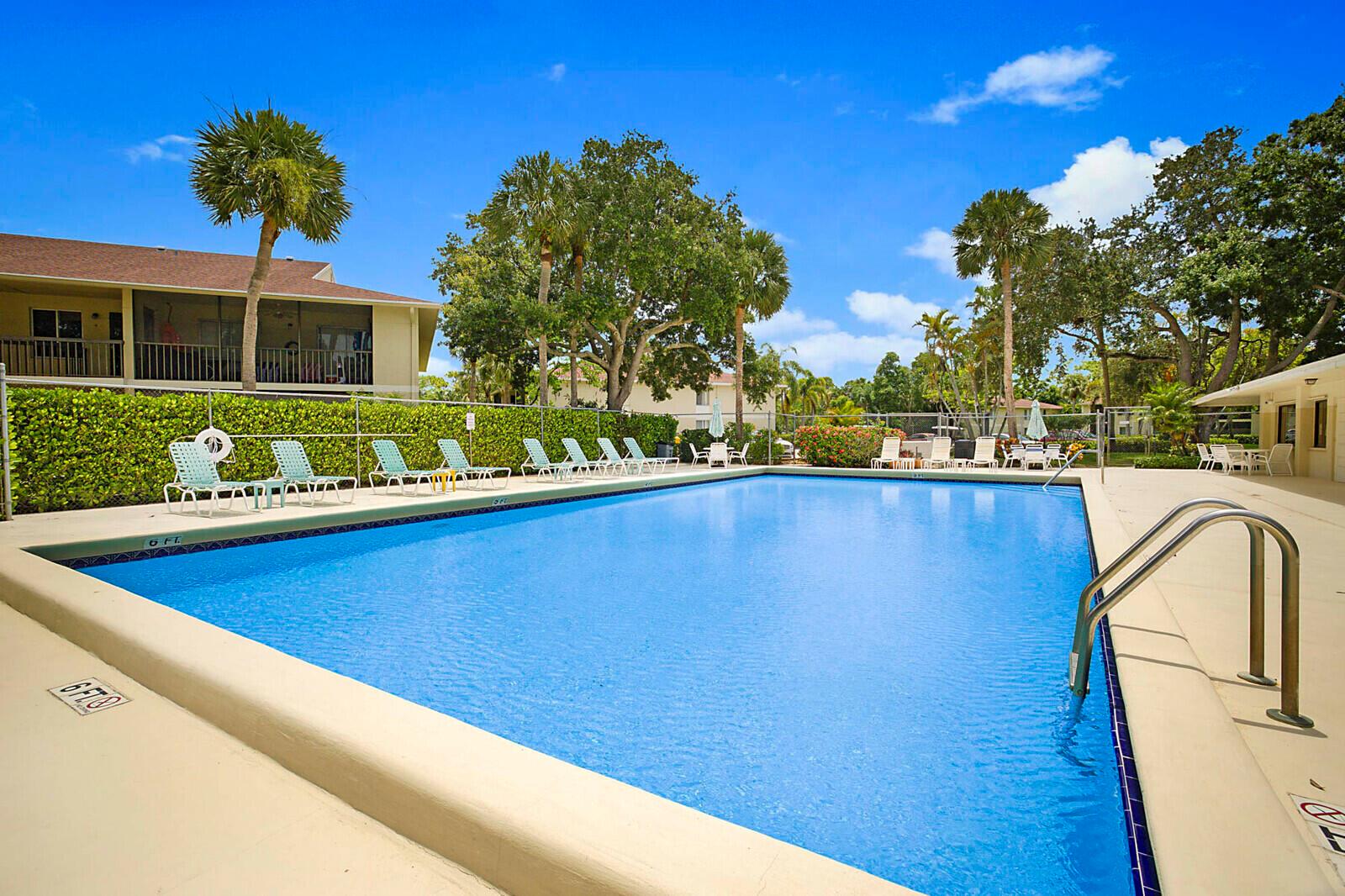 Coastal Charm in Jupiter! This airy 2BR/2BA condo features brand new flooring, new Air Conditioning, Fresh Paint and a spacious layout. The primary suite includes a step-in shower, walk-in closet & balcony access, perfect for morning coffee or unwinding at sunset. Screened-in balcony also opens from the great room with views of the tennis courts. Only Steps away to the Community Pool & Clubhouse & Tennis. 2 parking spots-(pickups & motorcycles permitted). Picnic & Car Wash area. Beautifully maintained community with year-round sunshine, friendly neighbors, top-rated Jupiter public & private schools. Close to I-95, Turnpike, Shops, Dining, Golf & 5 miles to the beach. Experience comfort, convenience & relaxed Florida living in one of Jupiter's most desirable & well-connected location.