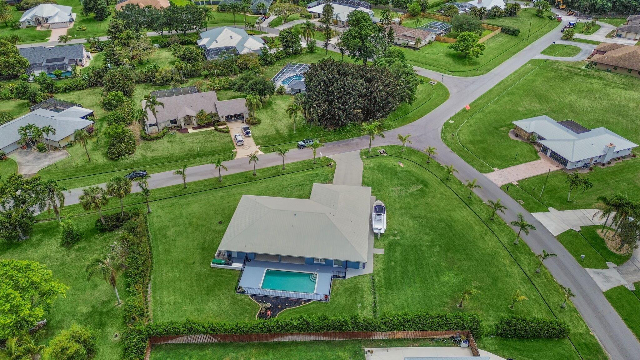 Live the Florida Dream! 🏝️ | CBS Home Sparkling Pool Half-Acre Lot Cabana Bath Room for Boat/RV Get ready to soak up the sunshine in this tropical Florida paradise! This beautifully updated 3-bedroom + den, 3 1/2-bath CBS home has everything you need for laid-back, luxury living--including a cabana bath for effortless poolside fun. Sitting on a spacious half-acre, there's plenty of room to roam, entertain, or store your boat or RV. Step inside to find cool tile floors throughout, charming plantation shutters, and an ideal split-bedroom floor plan perfect for privacy and relaxation. Updates? You're covered--with newer plumbing, HVAC, water pump, and pool pump already taken care of. Plus, the aluminum roof means peace of mind for years to come. But the real showstopper