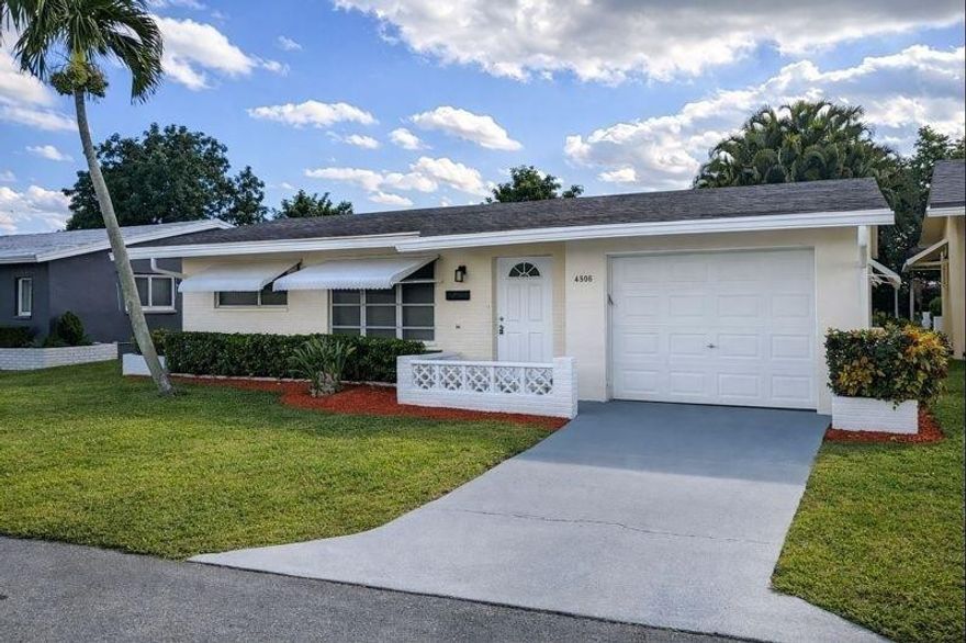 Just move in, hang your clothes, and stock the refrigerator — this turnkey home is vacant, easy to show, and ready for immediate occupancy. Located in the desirable Mainlands of Tamarac, this 2-bedroom, 1-bath residence with a 1-car garage offers comfort, style, and low-maintenance living in a vibrant 55+ community. Home features new laminate flooring throughout, a cosmetically updated kitchen and bathroom, and brand-new stainless steel appliances. Additional highlights include a formal dining room, fresh interior paint, new high baseboards, and an enclosed rear patio—perfect for relaxing or entertaining. The community offers an active lifestyle with clubhouse, pool, and much more, all with low maintenance fees. Association requires a minimum 700 credit score.