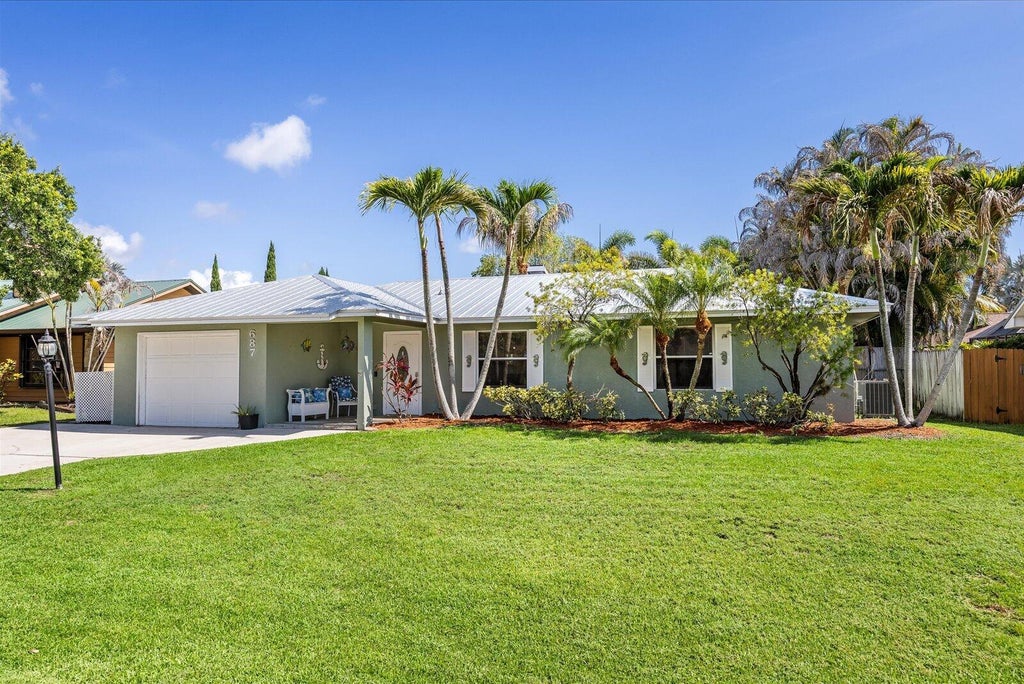 Photo of 687 NE Maranta, Jensen Beach, FL 34957 (MLS # B26040855)