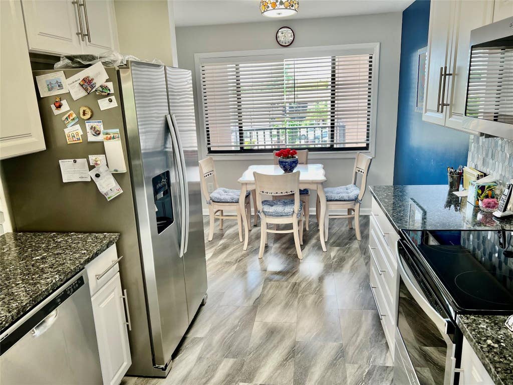 Photo of 9787 N BELFORT Circle #307, Tamarac, FL 33321 (MLS # B26064314)