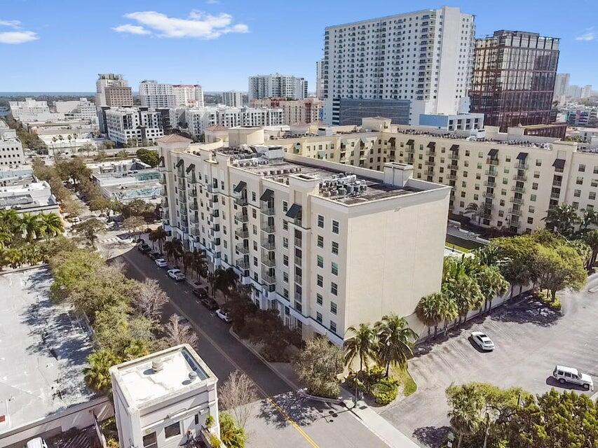 Prepare to be mesmerized by the unparalleled vistas from this beautiful 2-bedroom, 2-bathroom corner unit, offering stunning views of Rosemary Square, vibrant Downtown, the shimmering Intracoastal Waterway, and the elegant expanse of Palm Beach. Step inside to discover a comfortable and stylish space defined by high ceilings and quality finishes throughout, where every detail has been thoughtfully considered. The spacious master suite serves as a private sanctuary, featuring its own generous walk-in closet and a well-appointed bathroom. All bedrooms are comfortably carpeted, providing a cozy retreat, while the convenience of an in-unit laundry space and a private covered balcony further enhance daily living.