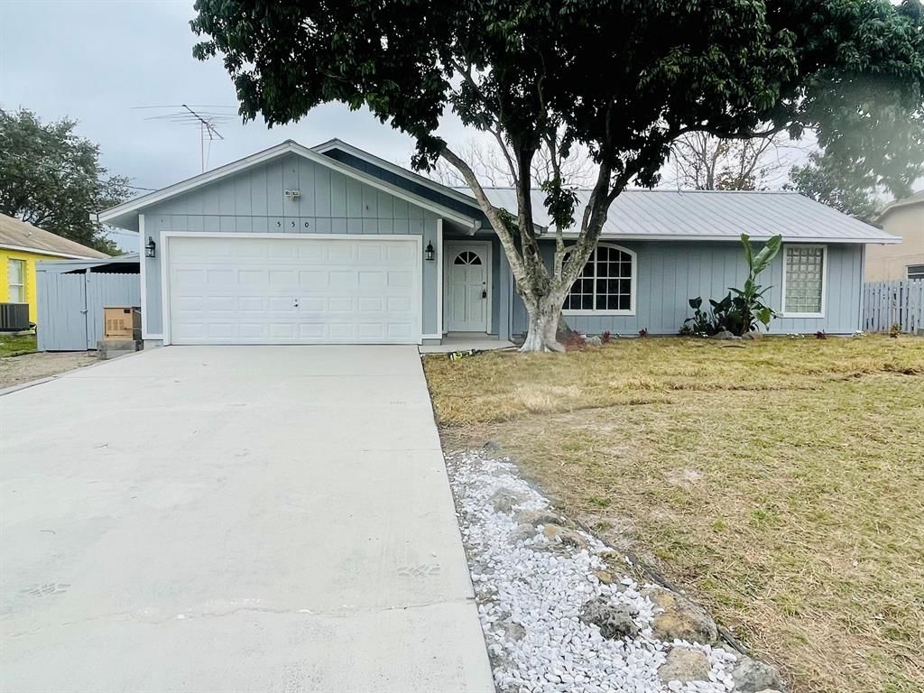 Photo of 550 SW Lacroix Avenue, Port Saint Lucie, FL 34953 (MLS # R10775633)