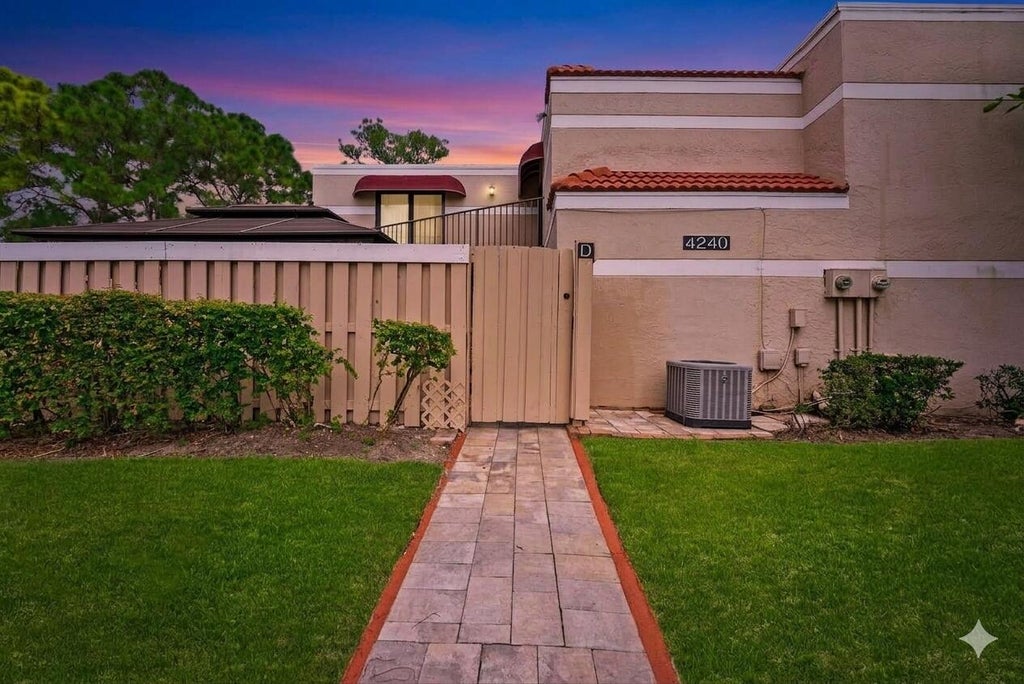 Photo of 4240 Village Drive #D, Delray Beach, FL 33445 (MLS # B26075407)
