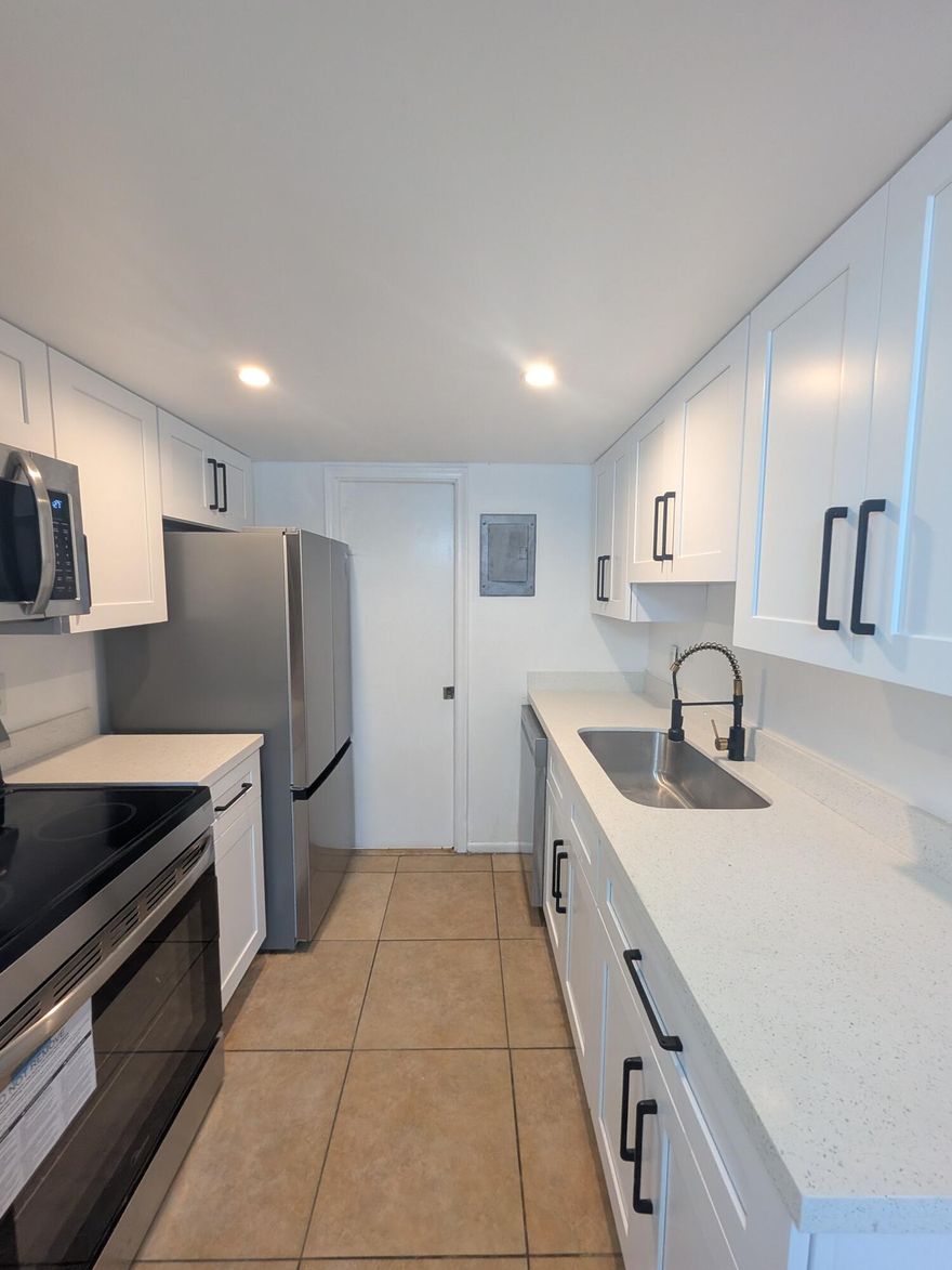 Stop looking for the perfect blend of value and peace of mind—you've found it. This stunning townhome offers the ultimate "worry-free" ownership experience. Say goodbye to high carrying costs with an exceptionally low association fee that incredibly includes water, sewer, and trash.The heavy lifting is already done: a brand-new roof (2026) provides maximum insurance discounts and years of protection. Best of all, because this is a townhome and not a high-rise condo, it is exempt from 40-year recertification requirements—meaning no looming special assessments for structural milestones. Perfect for first-time buyers or savvy investors looking for a high-yield, low-maintenance property.