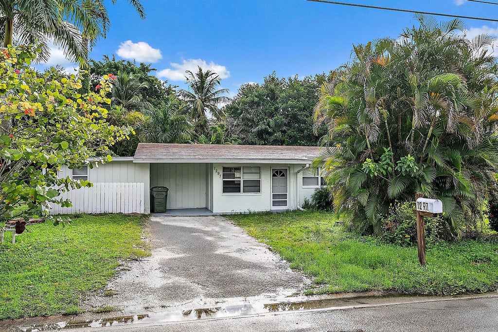 Photo of 1297 NW Charlie Green Drive, Stuart, FL 34994 (MLS # B26078564)