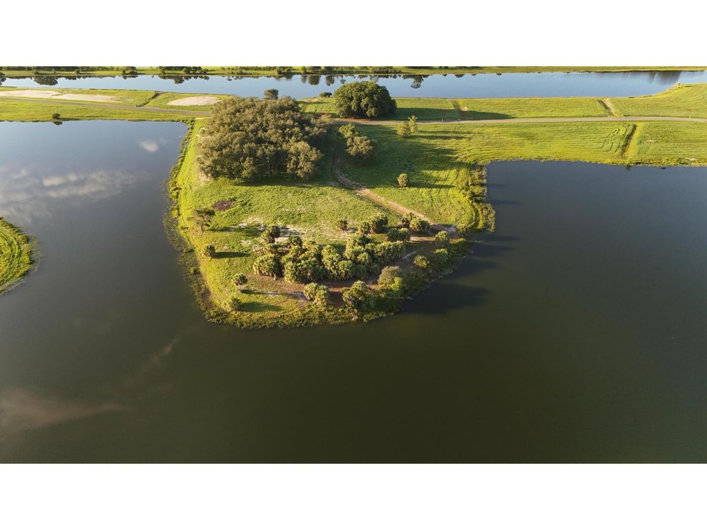 Photo of 6551 SW Pentalago Place, Palm City, FL 34990 (MLS # R11000191)