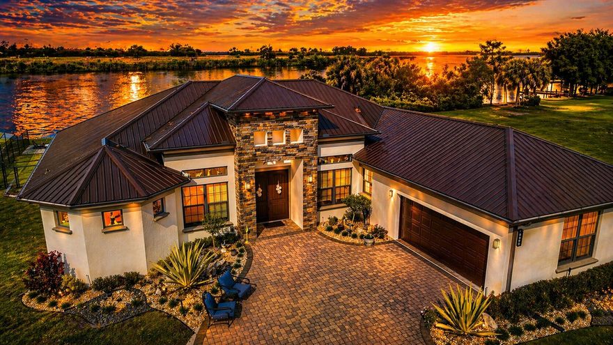 Wake up to tranquil lake views and enjoy a home designed for comfort, privacy and elevated living. This beautifully appointed residence features a rare and highly desirable layout with three spacious bedrooms, each with its own private en suite bath, plus an additional half bath for guests. A stylish den offers the perfect space for a home office, reading room or flexible retreat, while the eat in kitchen creates a warm setting for everyday living and easy gathering. Natural light and serene water views fill the home, creating a peaceful and refined atmosphere throughout. Step outside to your own private waterfront escape with direct lake access and a private boat dock, ideal for boating, fishing or simply enjoying the view. The fully fenced backyard offers privacy and versatility for entertaining or relaxing. Recent upgrades include an AC system less than one year old, storm gutters and a reverse osmosis water system. A spacious two car garage and expansive yard complete this exceptional property. This is more than a home. It is a lifestyle defined by waterfront living, privacy and effortless Florida luxury.