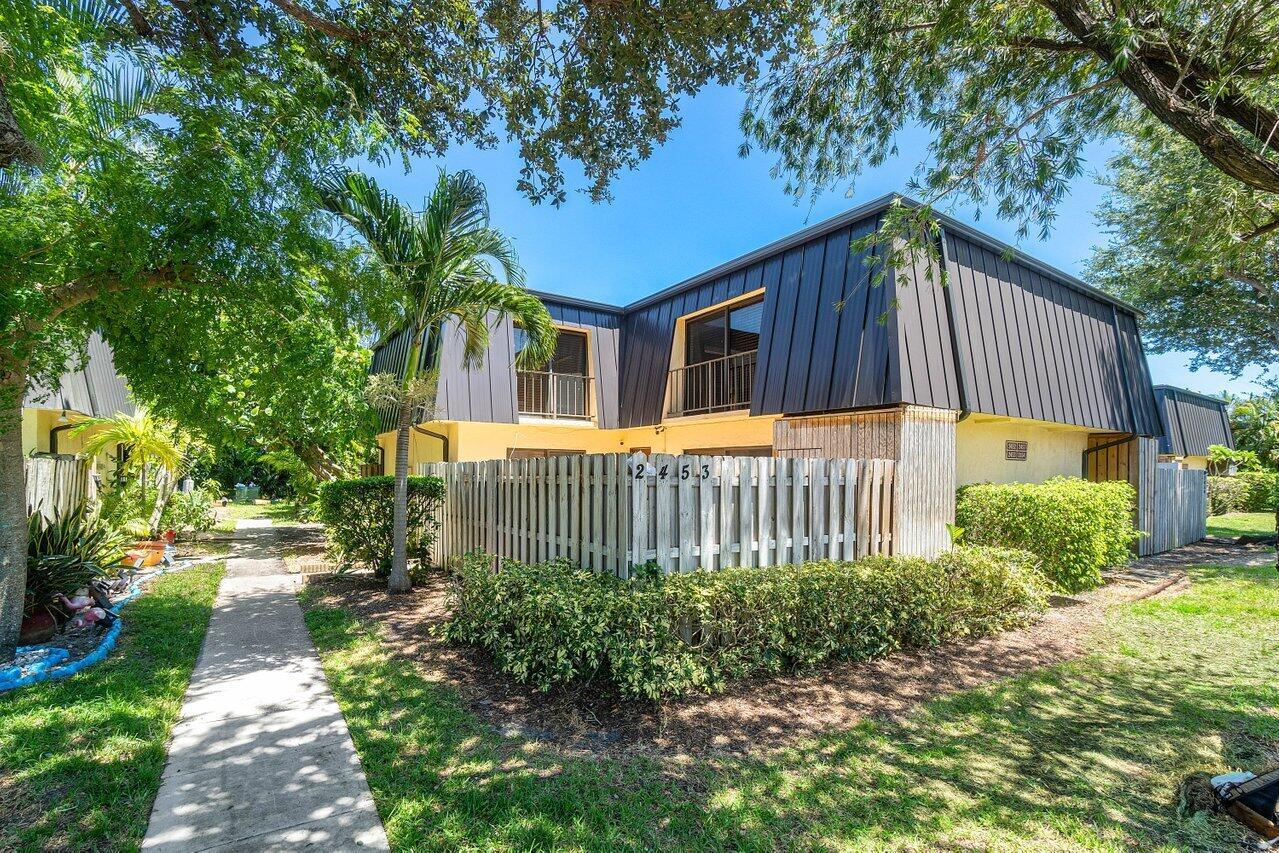 This stunning 2 bed, 2.5 bath townhome property features an open plan living room, dining and kitchen area with modern stainless steel appliances and fixtures. Upstairs features ample sized bedrooms, large format windows, walk in closet and two bathrooms. This property benefits from an abundance of natural light, creating a welcoming and homely atmosphere. A spacious paved patio area and tastefully landscaped exterior make this the perfect place for outdoor entertaining, or simply enjoying the Florida sunshine. Located across from a picturesque lake and within walking distance to the community pool. A short drive provides easy access to to local beaches, highways, shopping and restaurants.