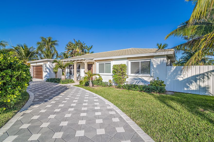 Beautiful, completely renovated, a boaters dream home in the highly sought after Town of Lake Clarke Shores! 3 bedroom 2 bath home on one of the only dead end streets in Lake Clarke, sitting on the large Palm Beach Canal with tons of room for a pool. Brand new kitchen with calcutta quartz countertops in the end of 2017, New tile roof in 2010, new dock in 2014 with a 9000lb Hi Tide boat lift and floating jet ski dock, all new LED lighting inside and out, New AC in 2016, PGT Impact Glass Doors, natural gas grill hookup, stove, water heater, and dryer. Truly a must see to appreciate home. Turn key and ready to move in!