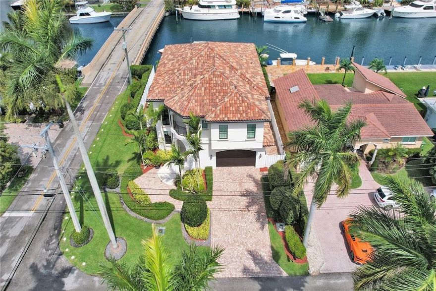 BRING ALL OFFERS! SELLER IS MOTIVATED & MOVING!  This gorgeous waterfront estate home was designed by Lighthouse Interiors & features 4 bedrooms, 4 1/2 baths, ocean access, custom heated pool/spa, 2 car garage, 70' of dockage with boat lift, extraordinary millwork & craftmanship, Chef's Kitchen with large island, all high end Thermador appliances, Butlers Pantry, Calcutta marble counters tops, wood floors, crown moldings, plantation shutters, stunning designer bathrooms, walk in closets, impact doors & windows, 22K generator with in ground propane tank, fireplace, camera system, surround sound, exterior Gazebo with kitchen, 15' extended concrete patio & raised dock, tankless hot water systems, security cameras, paver driveway, beautiful private fencing & much more! MUST SEE! Don't miss it! The Seller is moving and is motivated!  Bring all offers and don't miss out on this stunning waterfront ocean access estate home in East Fort Lauderdale. This gorgeous waterfront estate home was designed by Lighthouse Interiors & features 4 bedrooms, 4 1/2 baths, ocean access, custom heated pool/spa, 2 car garage, 70' of dockage with boat lift, extraordinary millwork & craftmanship, Chef's Kitchen with large island, all high end Thermador appliances, Butlers Pantry, Calcutta marble counters tops, wood floors, crown moldings, plantation shutters, stunning designer bathrooms, walk in closets, impact doors & windows, 22K generator with in ground propane tank, fireplace, camera system, surround sound, exterior Gazebo with kitchen, 15' extended concrete patio & raised dock, tankless hot water systems, security cameras, paver driveway, beautiful private fencing & much more! A MUST SEE!
