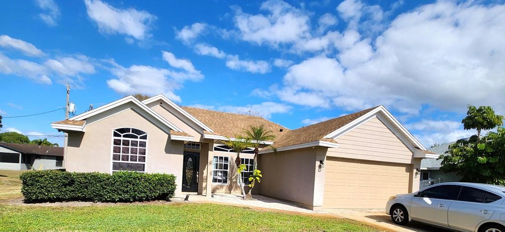 Photo of 721 SW Swan Avenue, Port Saint Lucie, FL 34983 (MLS # R11157026)