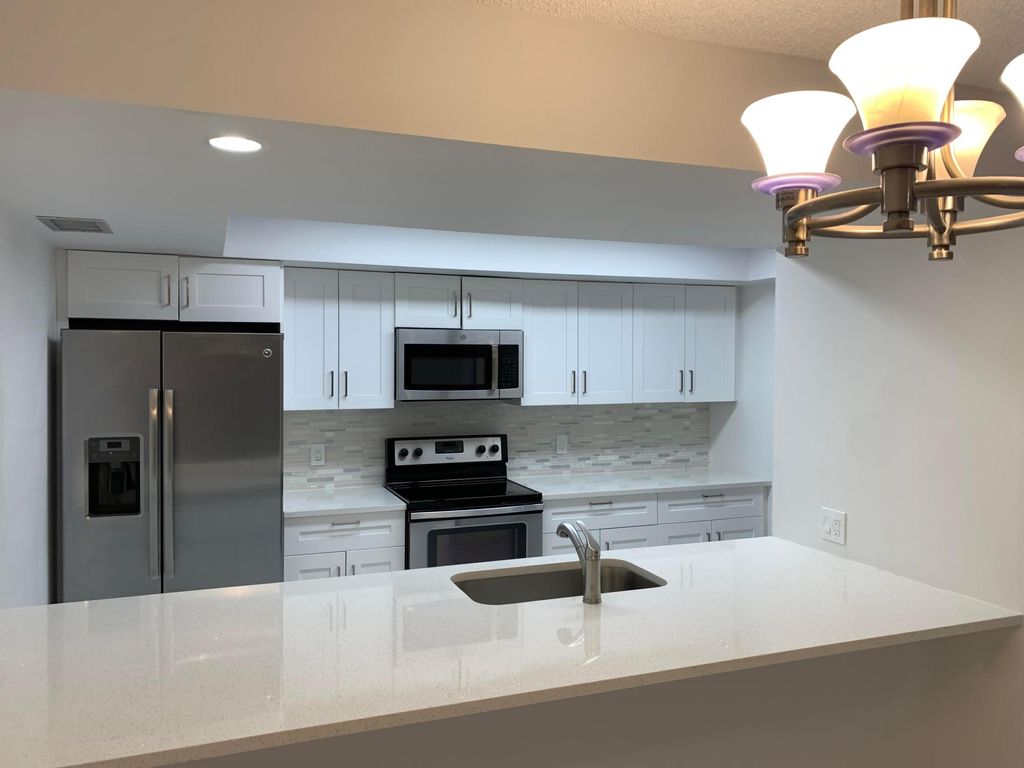 Photo of 3026 30th Lane, Greenacres, FL 33463 (MLS # R11096629)