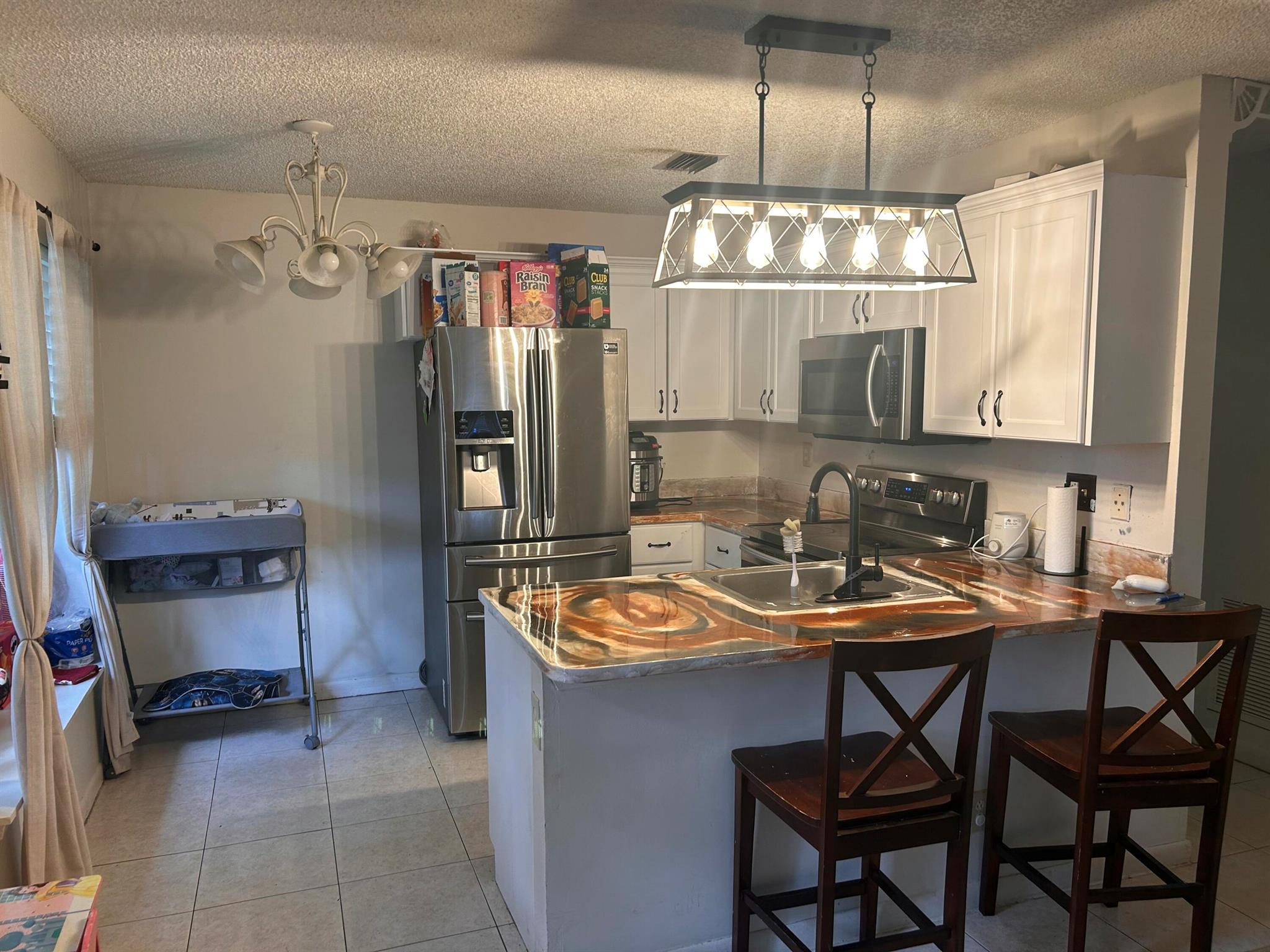 Corner home, 2/2 plus garage. Ceramic tile throughout, newer appliances, fenced yard