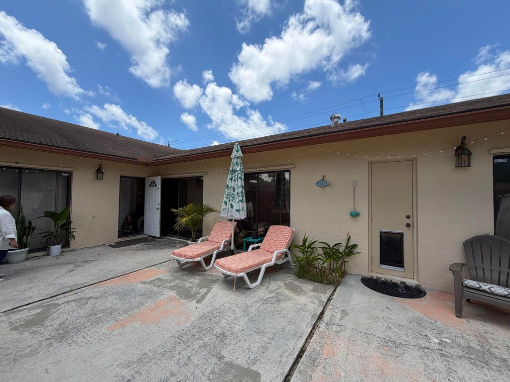 Photo of 1051 Summit Place Circle #D, West Palm Beach, FL 33415 (MLS # B26029517)