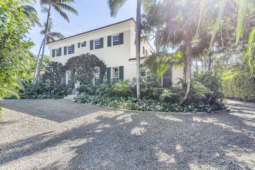 Pristine Palm Beach. This tranquil retreat, located in the secluded North End of world-famous Palm Beach Island, is surrounded by mature landscaping. The ornate arched entryway of this two story home leads to the gracious gallery foyer with beautiful arched columns. Pristine terracotta tile flows throughout most of the main floor living spaces. Flooded with natural light, the spacious living room overlooks the pool and leads through three sets of French doors to the patio and backyard. A gourmet kitchen features a gas range and stainless appliances. The downstairs is completed by a guest suite and large laundry room.