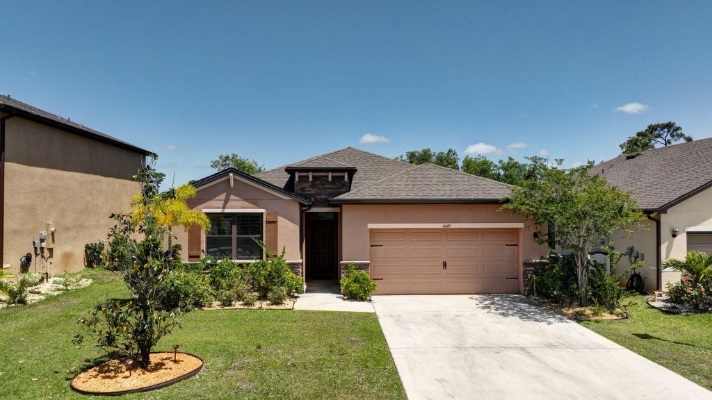 Photo of 6449 NW Castlebrook Avenue, Port Saint Lucie, FL 34983 (MLS # R11085878)