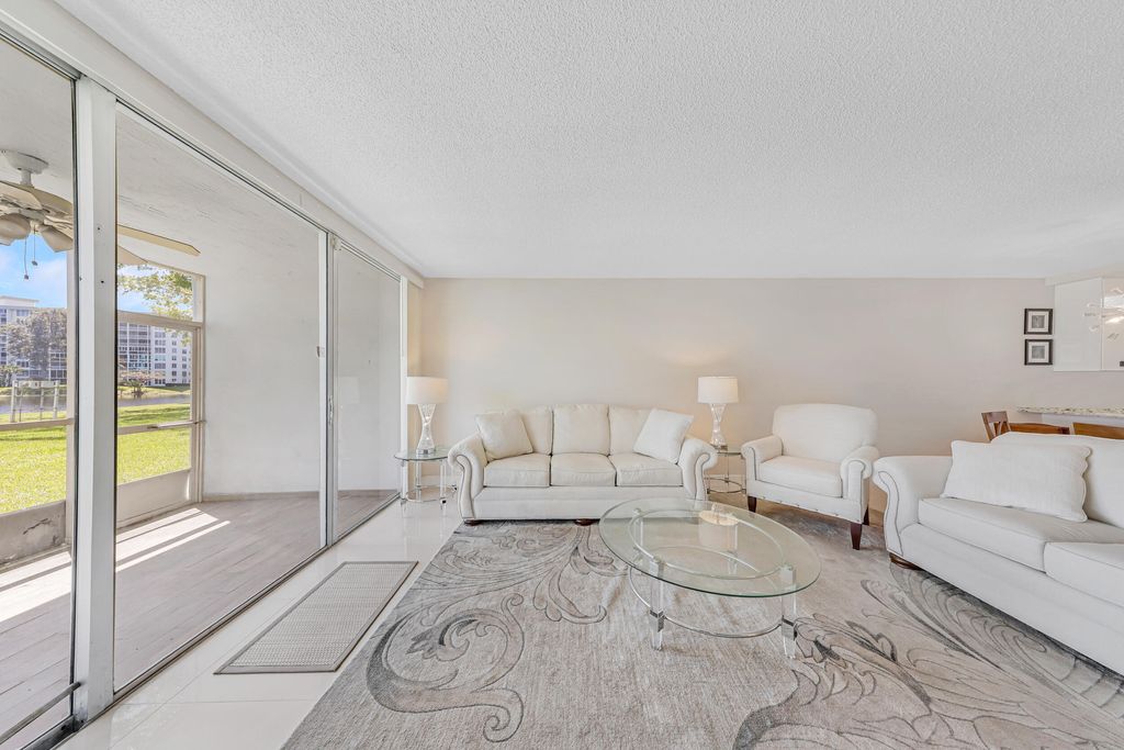 Photo of 3091 N Course Drive #102, Pompano Beach, FL 33069 (MLS # B26006730)