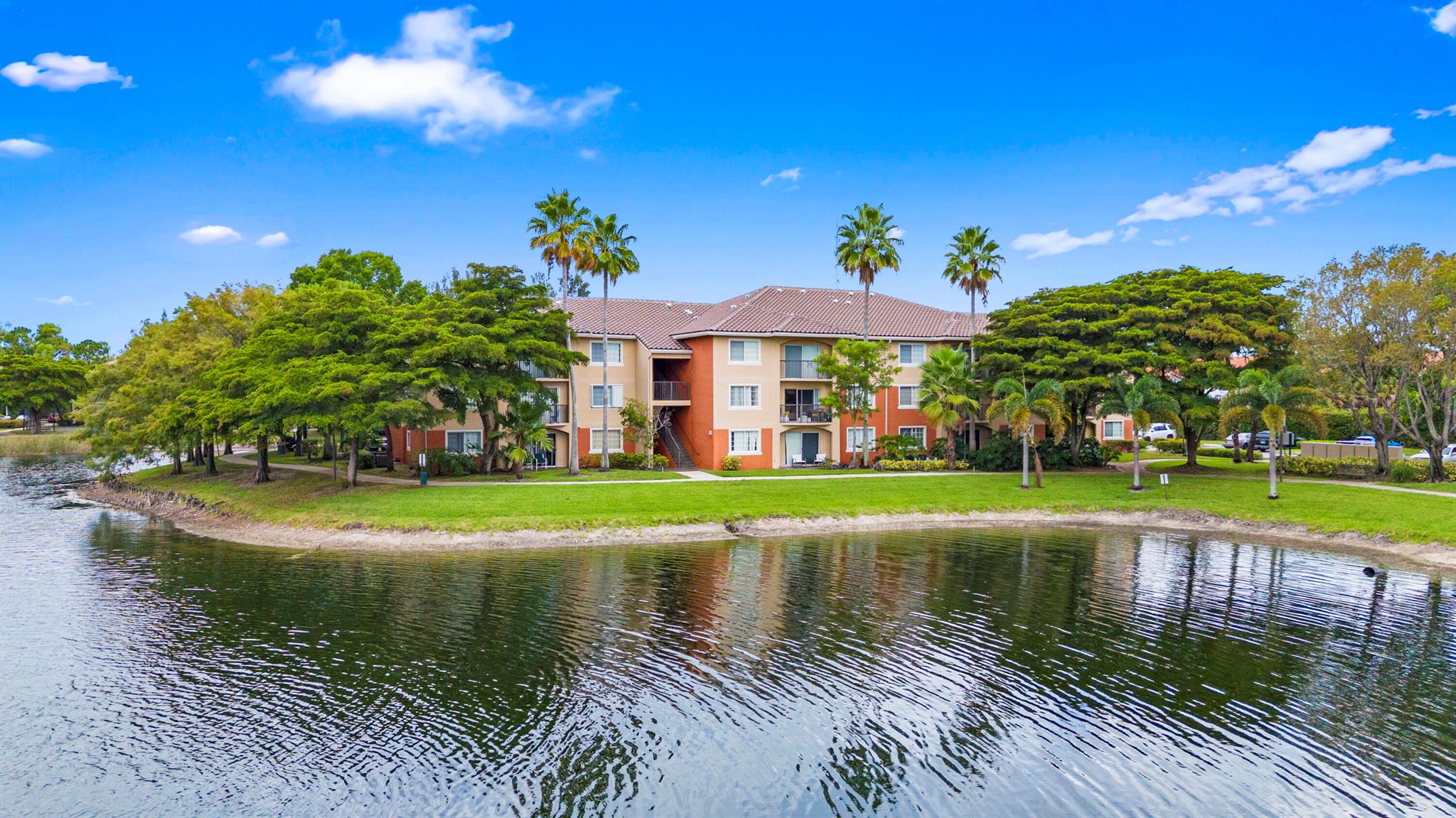 Welcome to resort-style living in this all-ages, pet-friendly community featuring a clubhouse, fitness center, sparkling pool, and tennis courts. This 2 bed, 2 bath waterfront home is designed for comfort and convenience, with both bedrooms offering private en suites for ultimate privacy. Enjoy the rare benefit of your own private garage with direct entrance into the unit.Inside, you'll find a bright and open layout with your own balcony, a full-size washer and dryer, and artistic touches throughout. No assessments here--just peace of mind in a safe, well-maintained community. Perfectly located near the heart of West Palm Beach, you're close to shopping, dining, entertainment, and major highways while still feeling tucked away in your own tropical oasis. Easy to find and easy to show!