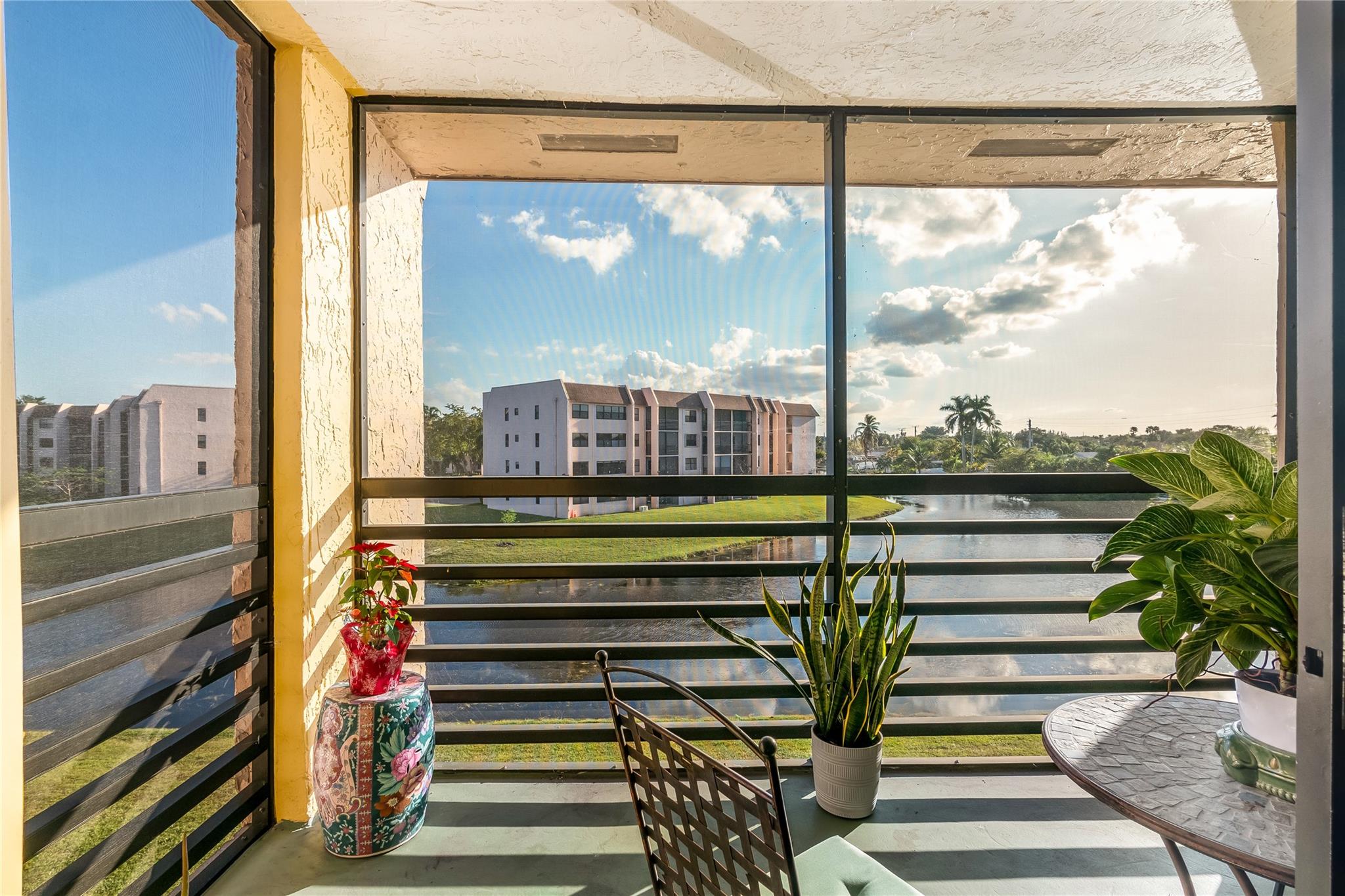 Discover your slice of paradise in this serene & vibrant 55+ active lifestyle community with courtesy bus, clubhouse, pools, sauna, spa & more. This top-floor, 1-bedroom, 1-bath home in the sought-after Sunrise Lakes community is a rare gem, boasting stunning, one-of-a-kind, long-range wide lake views that will take your breath away. Enjoy your morning coffee or evening relaxation on the screened-in balcony, where tranquil waters create the perfect backdrop for your daily retreat. This updated unit features Vinal wood flooring & crown molding throughout & lots of natural light with the added benefit of no neighbors above. Located in the newer section of Sunrise Lakes w/new elevator just steps from your front door.
Don’t miss the chance to make this exceptional lakefront oasis yours!
