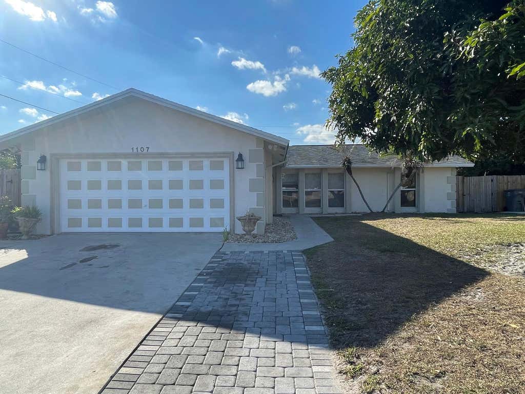 Photo of 1107 Woodcrest Road W, West Palm Beach, FL 33417 (MLS # R11162998)