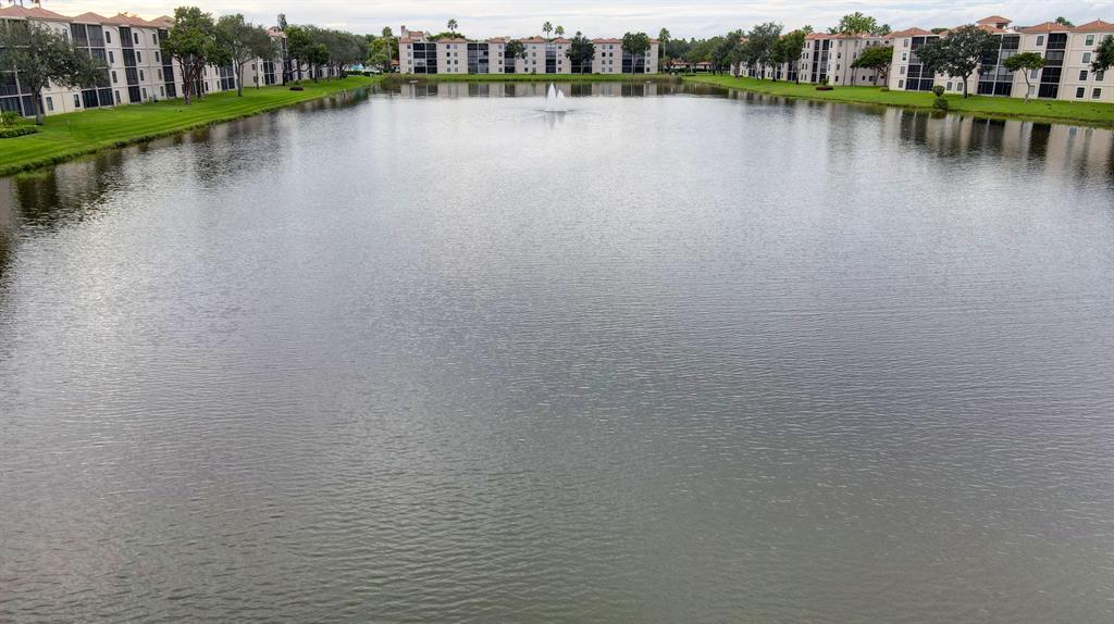 Beautiful lake views from this 1392 sf 2nd floor cond. Spacious two bedroom plus den ready for a new owner. Has a newer kitchen with quartz counters & newer stainless steel appliances. Newer ceramic tile throughout.Walk to the Clubhouse & have breakfast or lunch. You will enjoy as much as the previous owner has.