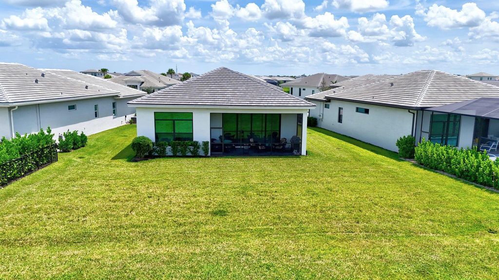 Photo of 9084 SW Arco Way, Port Saint Lucie, FL 34987 (MLS # R11121200)
