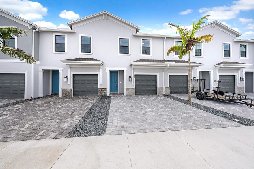 Brand-new construction, never before lived in townhome for lease in Camellia, a gated community in Stuart. This never-lived-in residence offers 2 bedrooms, 2.5 bathrooms, approximately 1,550 sq ft of living space, a one-car garage, and impact windows and doors. Ideally located less than one mile from both I-95 and the Florida Turnpike.The open-concept main level features a spacious living area and a modern kitchen with stainless steel appliances, pantry, and center island. Upstairs includes a primary suite with walk-in closet and dual-sink bathroom with glass-enclosed shower, a second bedroom, full bathroom, and upstairs laundry.Enjoy a private outdoor space with lake views and smart-home features for added comfort and efficiency.