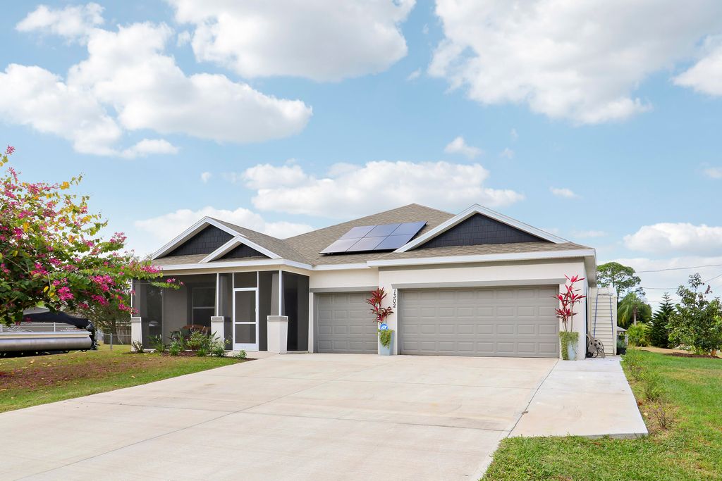 Photo of 1302 SE Naples Lane, Port Saint Lucie, FL 34983 (MLS # R11160183)