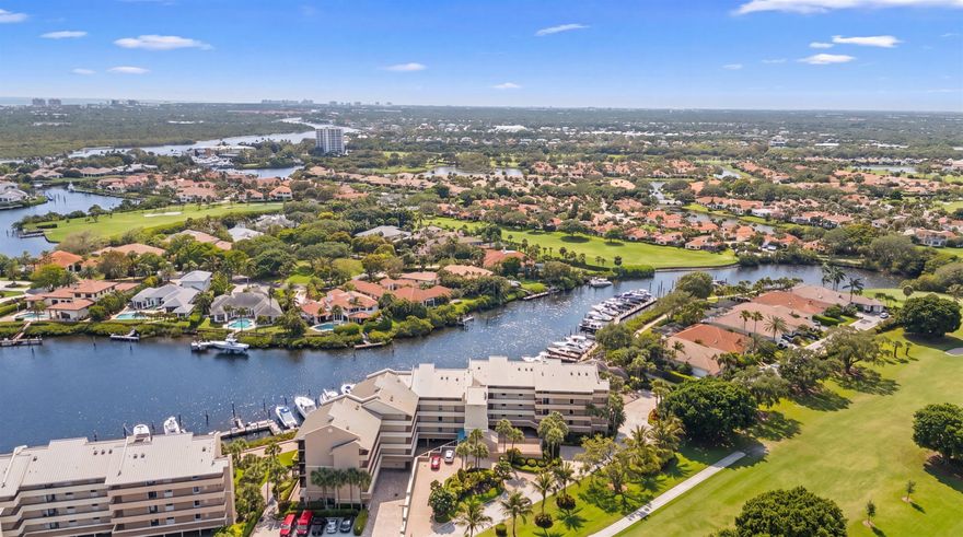 Welcome to the top! This exceptional penthouse residence in the Anchorage at Jonathan's Landing offers breathtaking, unobstructed waterfront views and the very best of coastal living. Ideally situated just minutes from the Jupiter Inlet with no fixed bridges, this home is perfect for boating enthusiasts.  Inside, you'll find two spacious primary suites, each thoughtfully updated, along with two and a half beautifully renovated bathrooms. The open-concept layout is designed for both comfort and style, featuring a chef's dream kitchen that flows seamlessly into a generous living area—perfect for everyday living and entertaining.  Step outside to the oversized screened balcony and take in tranquil, sweeping views of the Anchorage's private marina. It's the perfect spot to enjoy- see more peaceful mornings, stunning sunrises, and relaxing evenings by the water.  Additional features include impact windows (with the exception of the front door and kitchen window), an A/C unit approximately 8 years old, and a brand-new hot water heater, offering both comfort and peace of mind.  Residents of the Anchorage enjoy a range of desirable amenities, including covered parking, a golf cart garage, a private storage unit, and a waterside pool. This is waterfront living at its finest—ideal for both quiet enjoyment and hosting unforgettable gatherings.   --