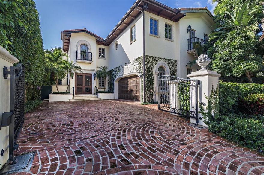 Prime in town location near shopping, fine dining, the beaches and town docks. This elegant 2 story Mediterranean townhome offers gracious entertainment rooms with 12' ceilings, French doors opening onto the pool and loggia offering indoor/outdoor living. Gardens designed by landscape architect Mario Never. Built in 1999 with over 5,200 total square feet. This home offers 3 bedrooms, 3.1 bathrooms, gated entry, 2 fireplaces, elevator, updated kitchen, and full house generator. Beautiful interior finishes and many improvements throughout. Gated privacy and lush gardens, this in-town townhome lives like a house but with the ease of a low maintenance townhouse.