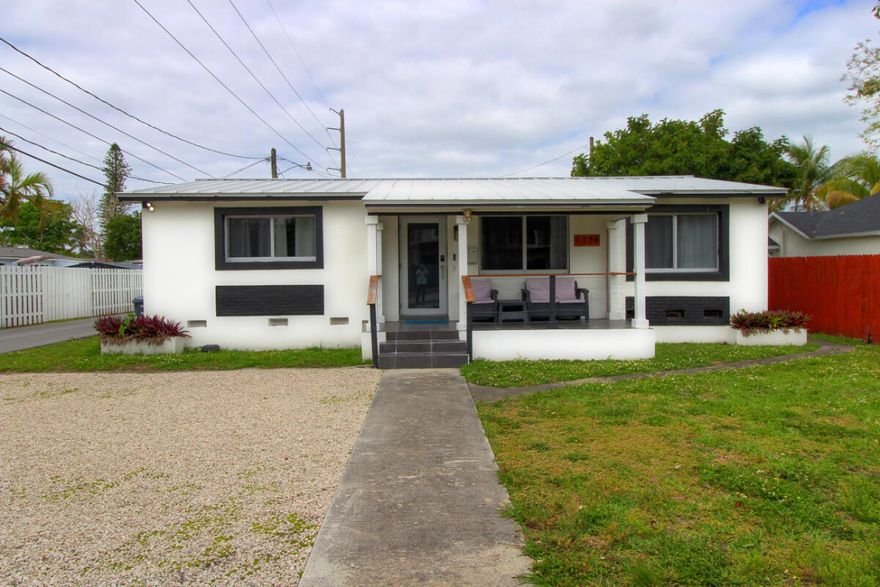 Turnkey East Hollywood gem blending style, comfort, and investment appeal. This beautifully updated 3BR/2BA home offers a bright, functional layout with modern finishes, inviting living spaces, and easy indoor-outdoor flow for everyday living or guest stays. Enjoy standout curb appeal, a newer metal roof less than 5 years old, welcoming front porch, screened patio, fenced yard, and generous parking. Perfect as a primary residence, vacation home, or income-producing property, it has a strong track record as a lucrative Airbnb rental. A new multifamily development across the street adds upside and future value. Ideally located near Downtown Hollywood, ArtsPark at Young Circle, Hollywood Beach Broadwalk, Dania Pointe, dining, shopping, and Fort Lauderdale-Hollywood International Airport.