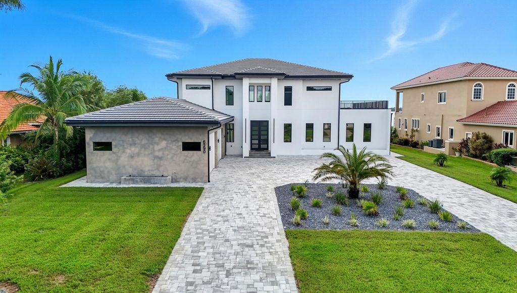 Photo of 6390 River Club Court, North Fort Myers, FL 33917 (MLS # R11167378)