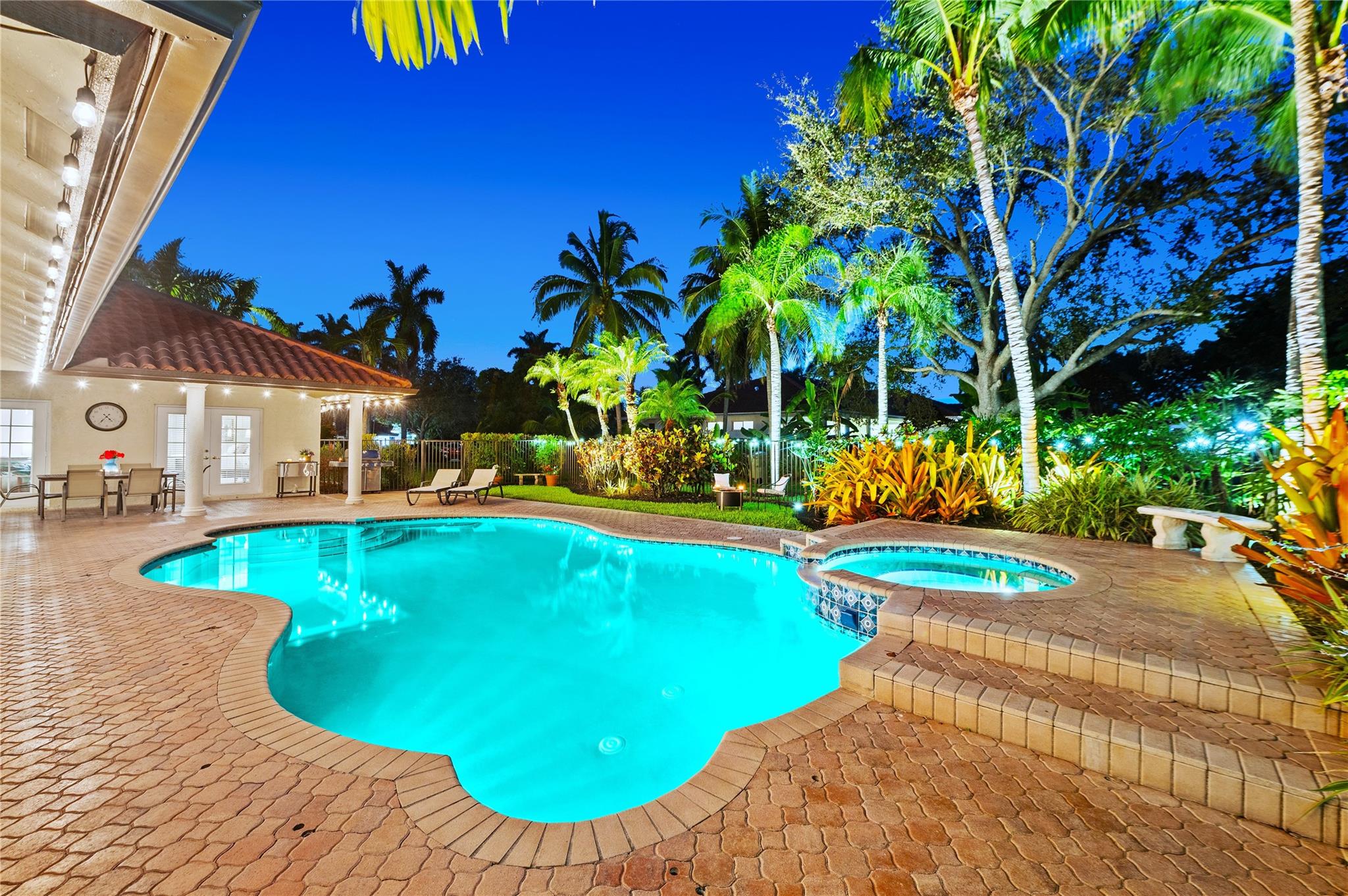 Sprawled on an expansive builder's acre on a cul-de-sac street in Shenandoah’s most exclusive enclave, this beautiful 5BR/3BA home of almost 3500sf, with timeless charm & inviting comfort, is set back from the road with manicured grounds, a long driveway, travertine walkway & magnificent fully fenced resort-style pool/spa area, outdoor lighting & tropical landscape. Gracious formal areas, charming atrium w/fountain. Granite kitchen with white cabs, wine fridge, double ovens & breakfast area overlook the generous covered patio w/twinkling lights. Family Rm w/wet bar leads to a spacious recreation room, perfect as game or media. Plantation shutters, new flooring in primary suite, new ACs & oversized 2.5CG. Welcome home to peaceful country living, just minutes from city conveniences.