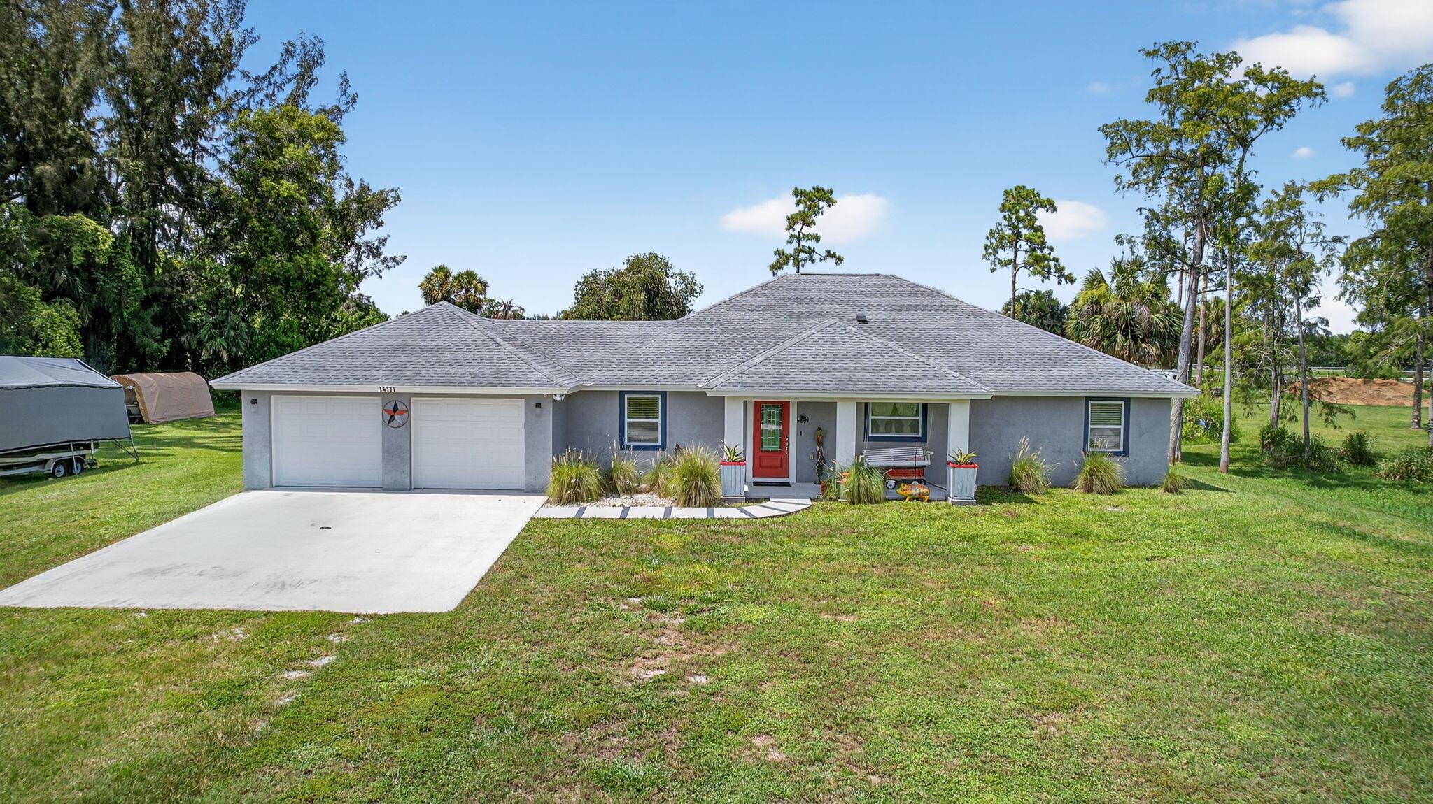 Custom 2019 build on 2.5 acres surrounded by equestrian farms and located on a quiet dead-end road--perfect for horse lovers! This split floor plan offers a spacious master suite with walk-in shower and closet, a second en-suite with full bath and oversized closet, plus a third bedroom with guest bath access. Gourmet kitchen features quartz counters, a large island with glass cooktop, double ovens, premium cabinets, and 3 pantries. Smart electric throughout, including bathrooms. Enjoy a large laundry room with utility sink, an oversized 2+ car garage, covered front porch, and a screened back patio. Plenty of room to build a barn, paddock, or a riding arena. Bring your offer and let this property be your new home.
