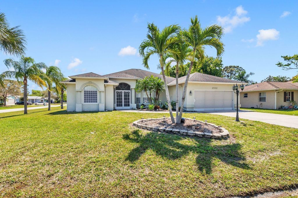 Photo of 2592 SE Calusa Avenue SE, Port Saint Lucie, FL 34952 (MLS # R10968543)