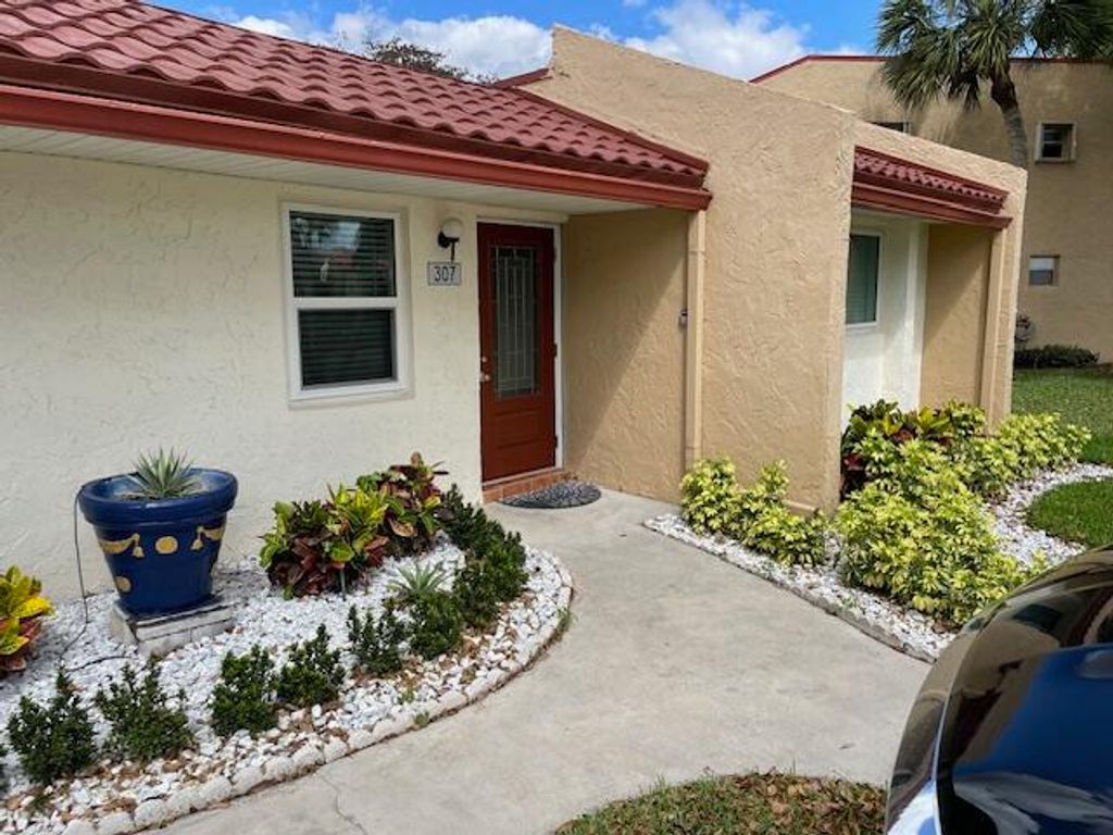 Photo of 307 Lake Evelyn Drive, West Palm Beach, FL 33411 (MLS # B26005213)