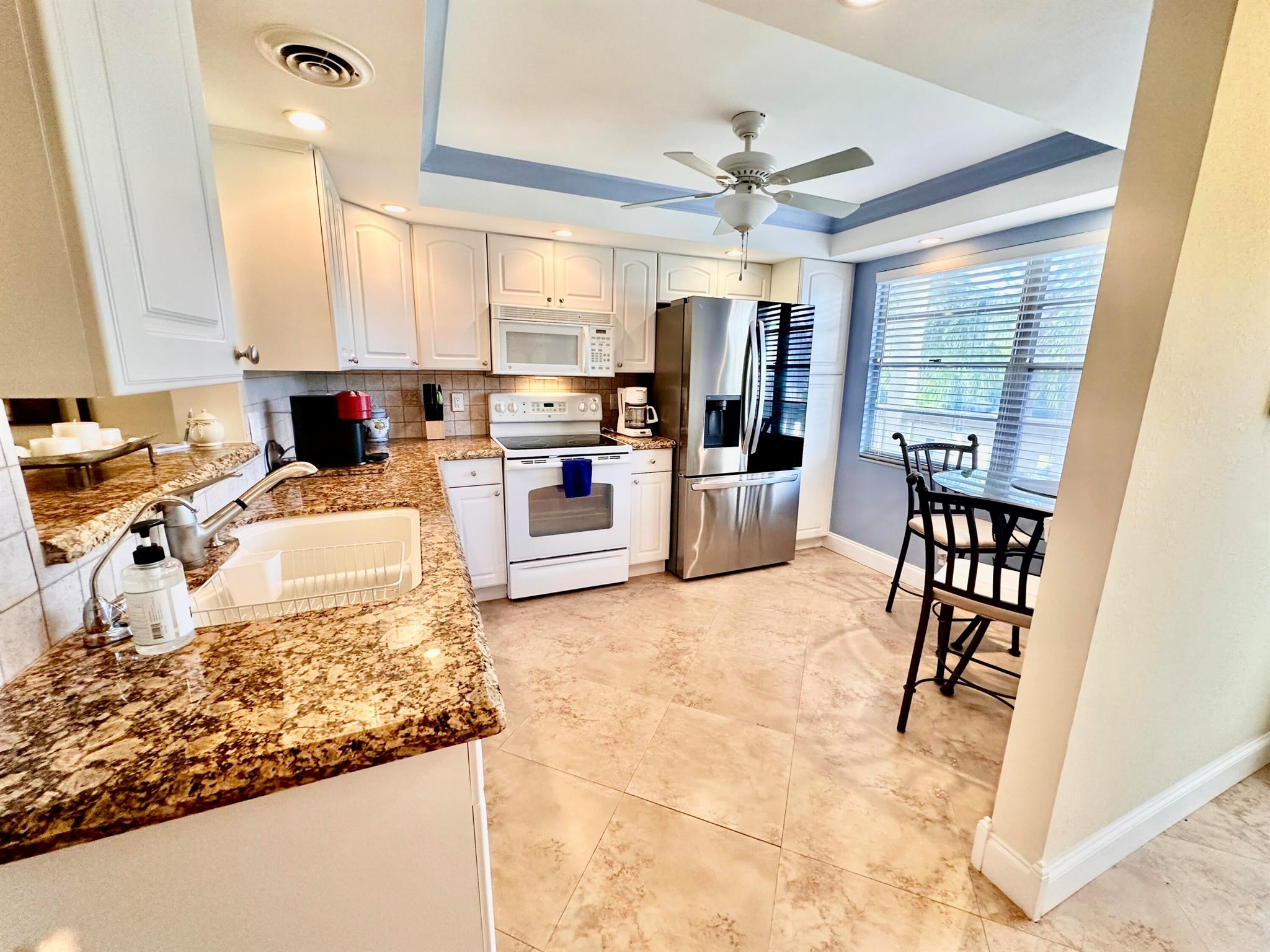 REDUCED TO SELL NOW! 2/2 CONDO NESTLED ON THE WATER WITH LIGHTED FOUNTAIN GOLF VIEWS! Stainless kitchen ''Magic''' door frig! Upgraded electrical outlet/baseboards, widened hallway access to split bedroom floorplan, elegant ''Room Specific'' furniture to relax and enjoy what Wynmoor Senior community has to offer! Senior living in WYNMOOR GOLF COMMUNITY at its finest! Marker 13 off Wynmoor inner circle. Wynmoor amenities include; Golf 18 holes, Golf cart charge up at village parking area, Courtesy Bus, Live Entertainment, Theatre, $2.00 First run Movies in our own Movie Theatre, Fitness Center, Pickleball, Tennis, Racquet Ball, main POOL - Lazy River Wave, Lap, Whirlpool and more!