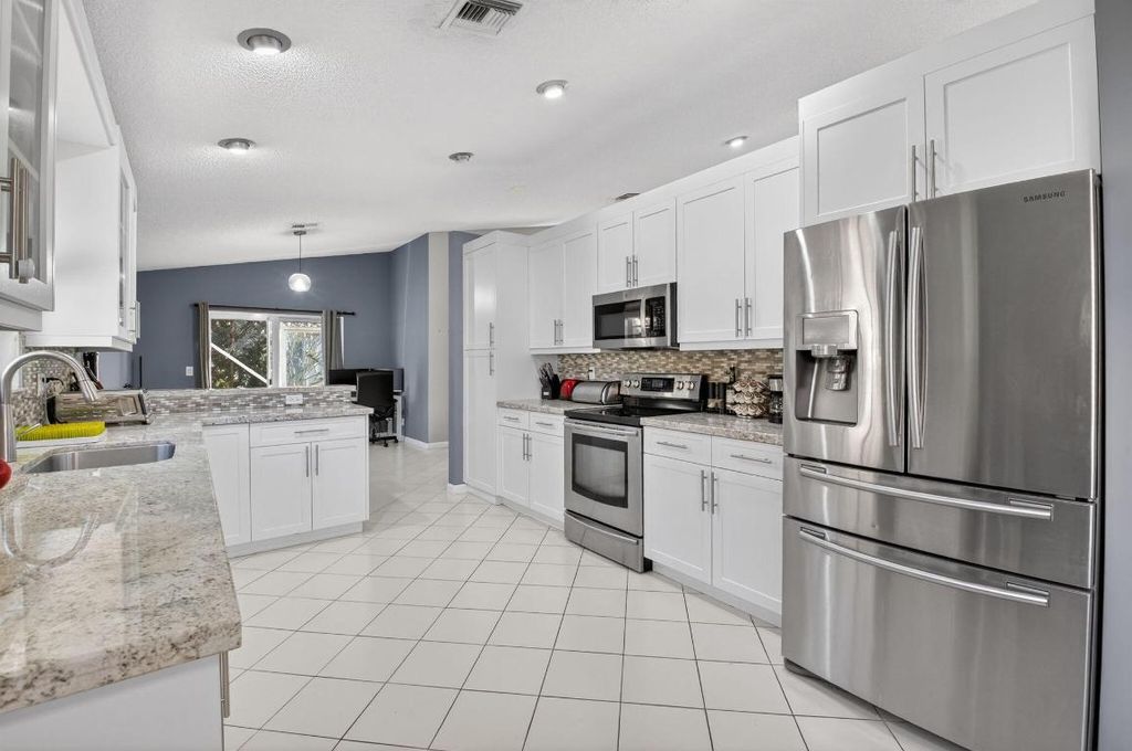 Photo of 5350 Casa Real Drive, Delray Beach, FL 33484 (MLS # R11155383)