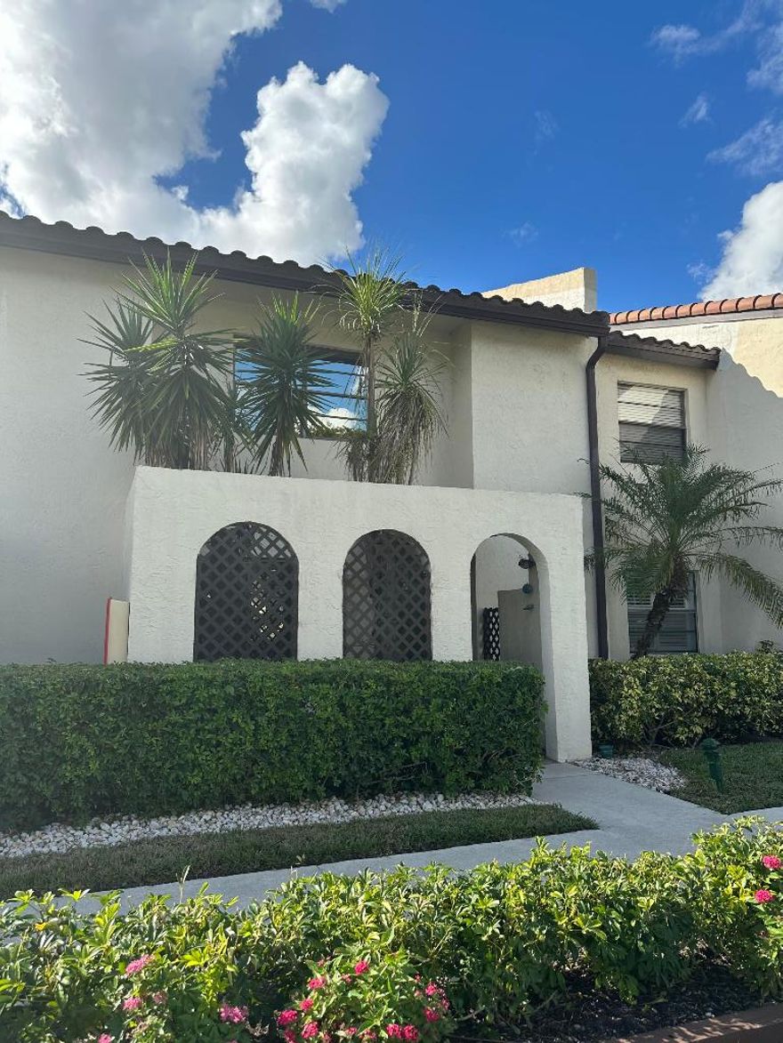 Welcome to this light and bright 2BR/2.5BA lakefront townhouse in the gated 55+ community of The Glades at Boca Lago. This well-maintained, renovated home features an updated eat-in kitchen with granite countertops, premium cabinetry, and stylish backsplash, along with an open living and Florida room filled with natural light and serene lake views. Upstairs offers two spacious bedrooms, including a primary suite with lake views, ample closets, and an updated en-suite bath. An oversized utility/storage closet provides exceptional extra space rarely found in townhomes. Enjoy peace of mind with a new roof installed by the association in 2020. One pet allowed. Country club membership is optional. Ideally located near shopping, dining, golf, beaches, major highways, and airports—this is South