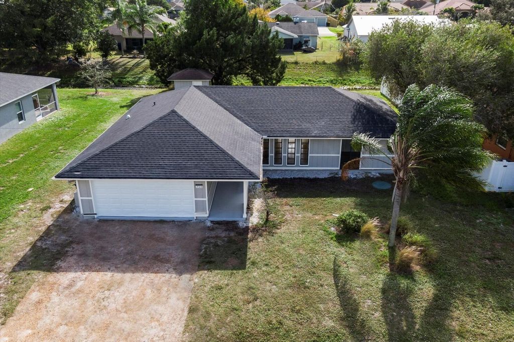 Photo of 714 SW Saragossa Avenue, Port Saint Lucie, FL 34953 (MLS # R10944942)