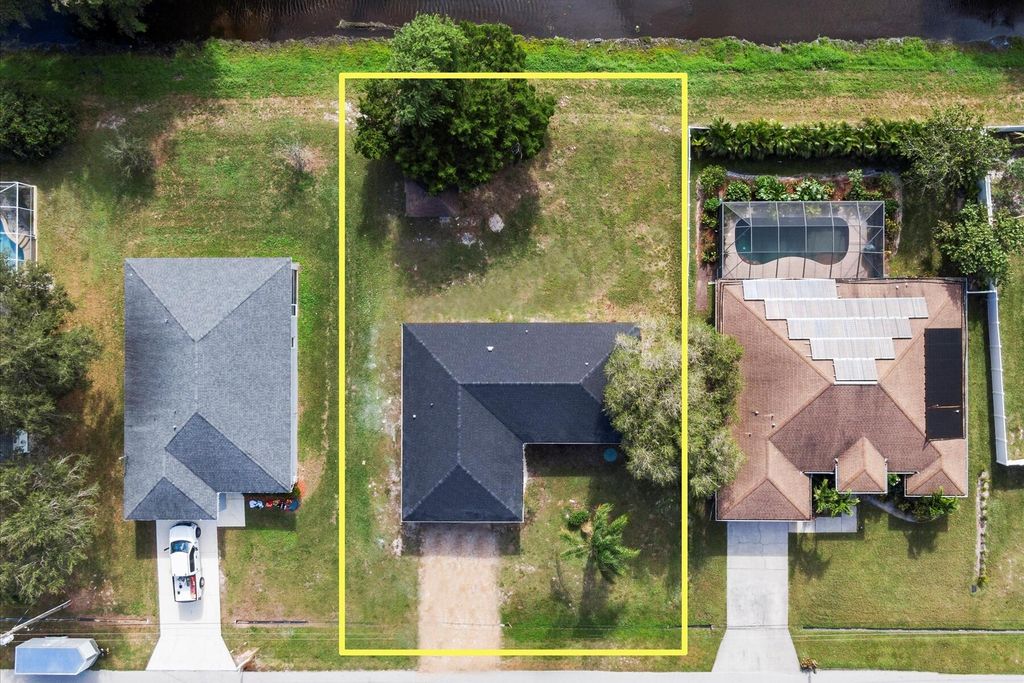 Photo of 714 SW Saragossa Avenue, Port Saint Lucie, FL 34953 (MLS # R10944942)