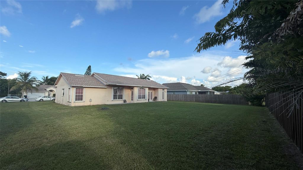 Photo of 1618 SE Ridgewood Street, Port Saint Lucie, FL 34952 (MLS # F10510984)