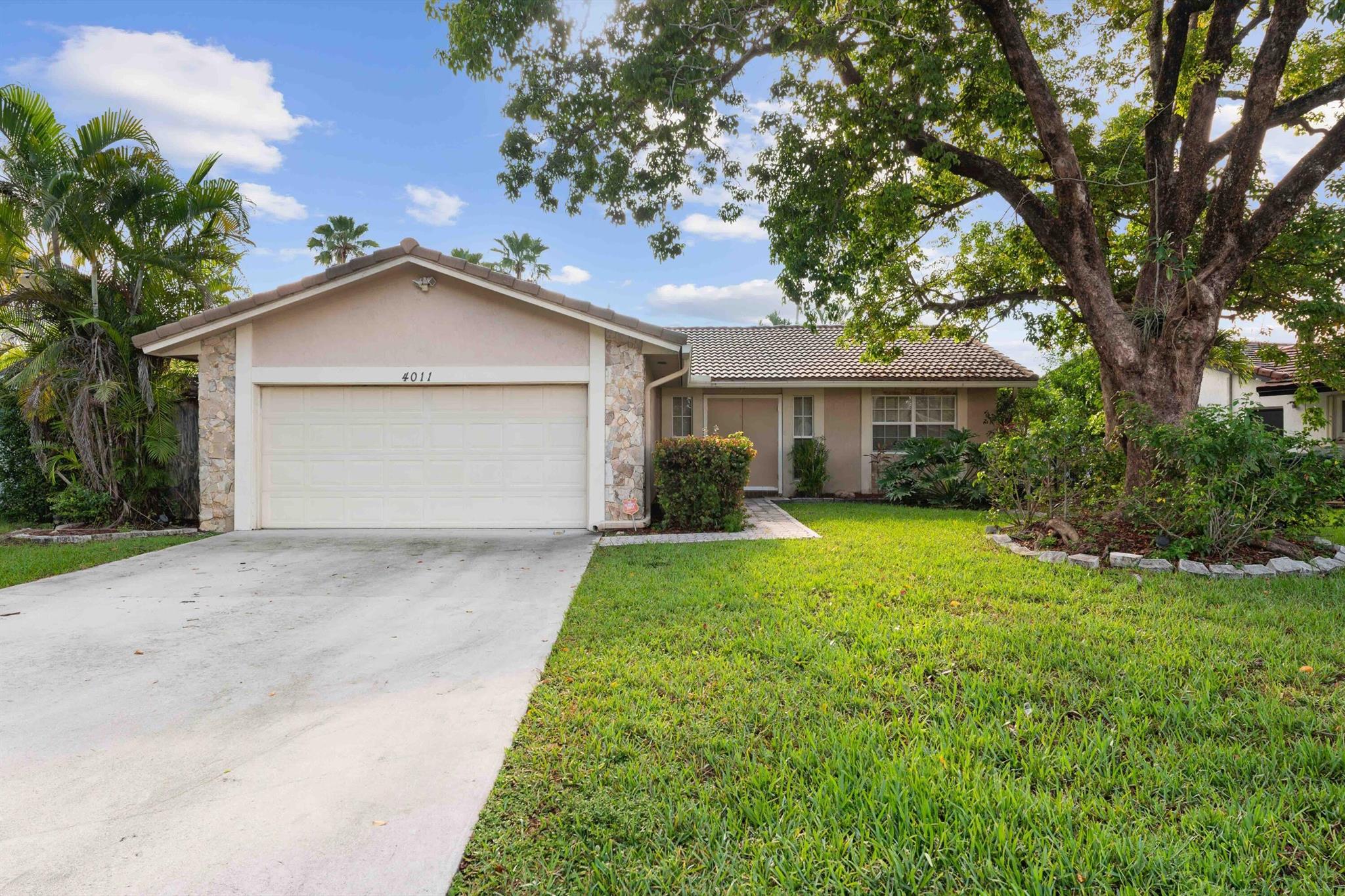 Wonderful Single family home in the heart of Coral Springs! 3BR/2BA waterfront pool home with private fenced yard and paver patio. This well-maintained home features a spacious layout with wood and tile flooring throughout - no carpet, freshly painted interior, and IMPACT WINDOWS and French doors. The open kitchen boasts granite countertops and stainless steel appliances. Enjoy a formal dining area, a large covered patio, a built-in outdoor BBQ, and a freeform pool overlooking the lake. Additional highlights include a durable S-tile roof and excellent curb appeal. Located in a desirable neighborhood--this turnkey home is priced to sell and ready for its new owner!