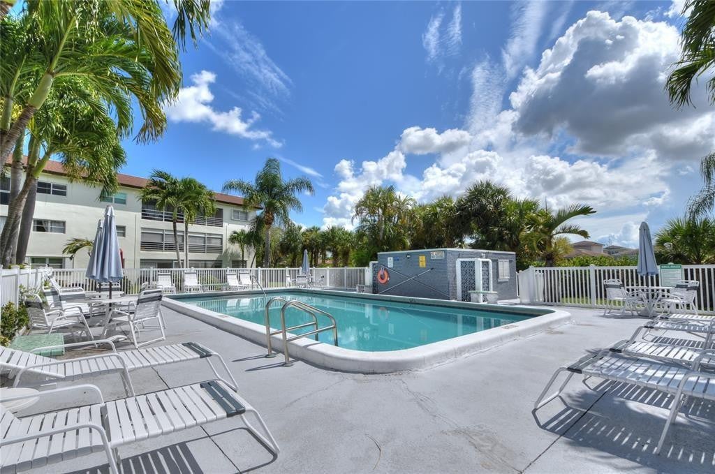 Photo of 4200 CRYSTAL LAKE Drive #212, Deerfield Beach, FL 33064 (MLS # B26078623)