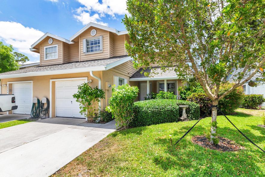 Charming townhome in the heart of Wellington! Featuring 3 bedrooms and 2.5 baths, this home boasts a desirable first-floor primary bedroom and bathroom. Recent upgrades include brand-new flooring in the master suite, a renovated upstairs bathroom, a new roof, HVAC 
system and ducts. A new fenced backyard with elegant pavers and hedges gives you a quiet and private outdoor space. The driveway has been expanded to accommodates two cars alongside a garage. Equipped with accordion shutters for full storm protection. Just minutes away from world-class equestrian events, shopping, and dining, experience the best of Wellington living!