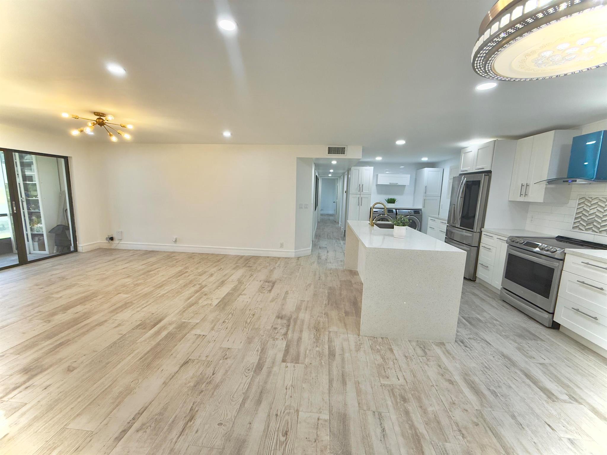 Beautiful full remodeled 3 Bedrooms 2 Bathrooms plus office, water, wifi and cable are included, just pay for electricity First floor unit with large kitchen area featuring white shaker cabinets and quartz countertops. Wood looking porcelain floor throughout, ceiling fans and recessed led lights, full size washer and dryer. Modern walking showers, Relaxing views from the screened patio. Washer and Dryer. 1 assigned parking and other parkings available. Gated community offers clubhouse, pool, tennis courts, walking paths and more.Convenient location close to shoppings, restaurants, schools, medical facilities and beautiful beaches.