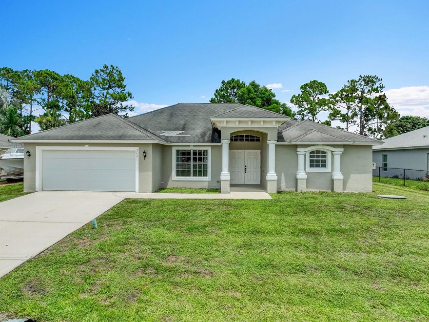 Unpack and relax in this stunning and spacious 5-bedroom, 3-bathroom home, offering an abundance of living space. The luxurious primary bedroom is a highlight, complete with a cozy sitting area for ultimate relaxation. Embrace indoor-outdoor living with the inviting screened-in patio, perfect for al fresco dining or enjoying the Florida breeze bug-free. Commuters rejoice with an exceptionally convenient location providing quick access to I-95. A perfect blend of comfort, style, and accessibility!