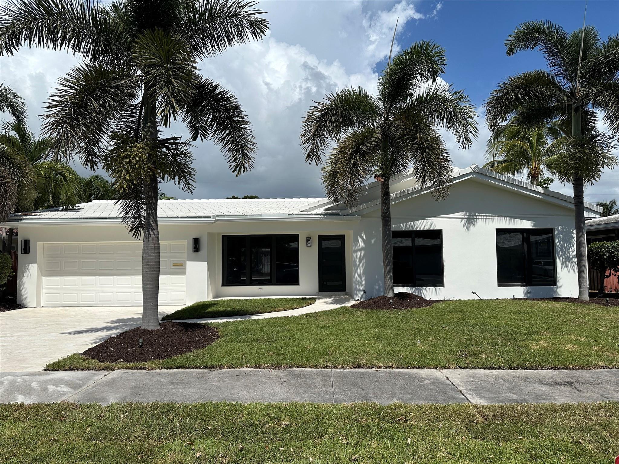Stunning 3BR/3BA + den in prime Ft. Lauderdale! Entertain with a luxe cabana bath opening to a marble limestone pool deck surrounded by lush landscaping. Fully updated with new plumbing, electrical, impact windows/doors, engineered hardwood floors, sleek tile click-and-lock roof. Chef’s kitchen w/ quartz counters, wood cabinets, Kohler brass fixtures, 6-burner gas range, 40" vented commercial hood, 48" GE Café fridge/freezer, Samsung dishwasher, and Whirlpool microwave. Custom Kohler vanities, frameless showers, and elegant finishes make this home truly turnkey
